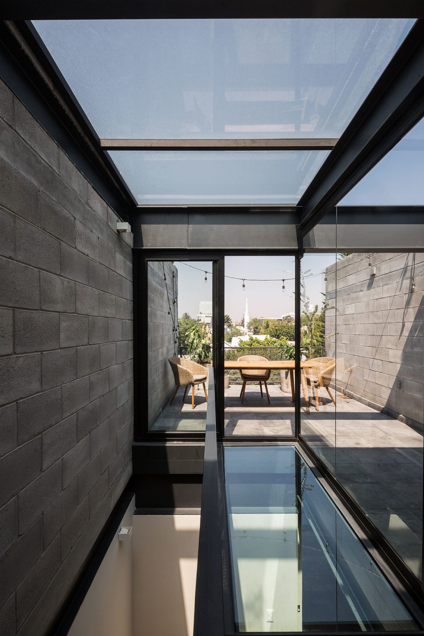 Glass and steel structure creates a shaded public area