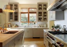 Gorgeous-traditional-kitchen-with-a-custom-island-that-features-wooden-countertop-217x155