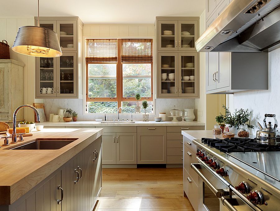 Gorgeous traditional kitchen with a custom island that features wooden countertop