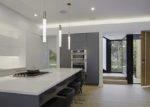 Gray-and-white-kitchen-with-minimal-pendant-lights-217x155