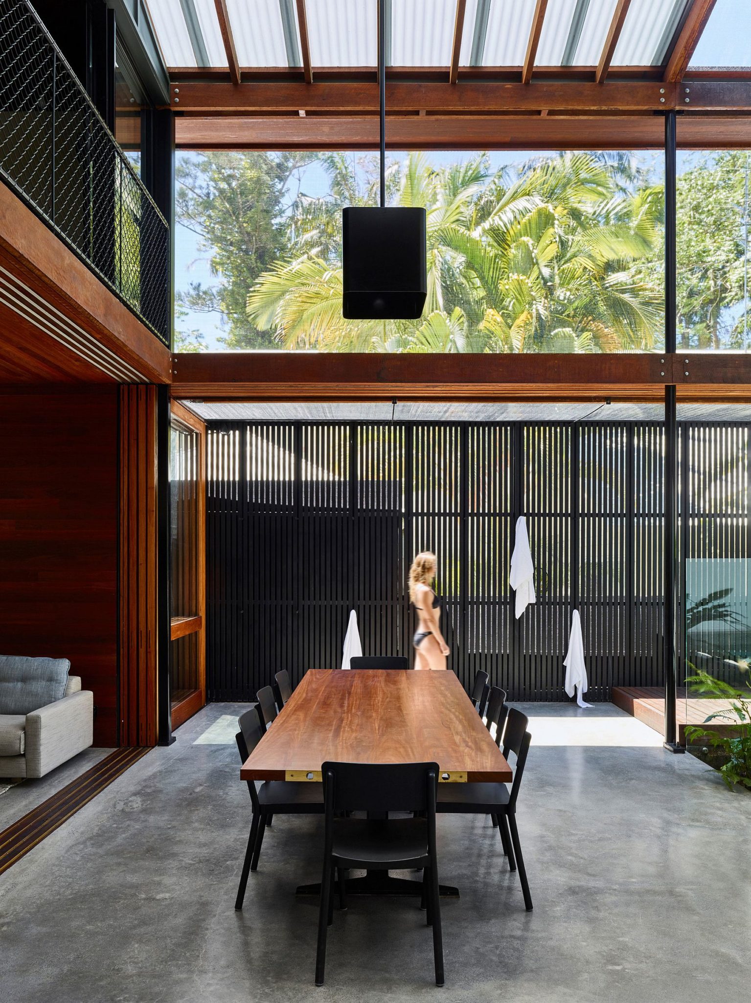 Greenery outside becomes a part of the open dining space