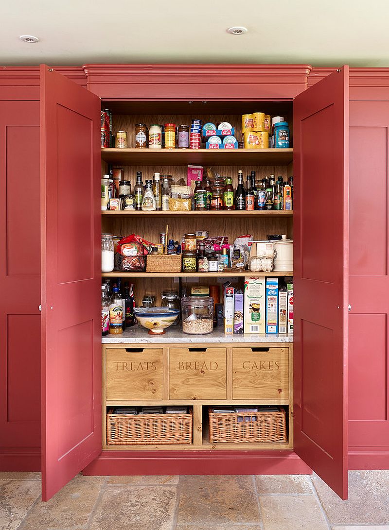 Handmade wooden boxes and baskets bring contrast to the traditional pantry