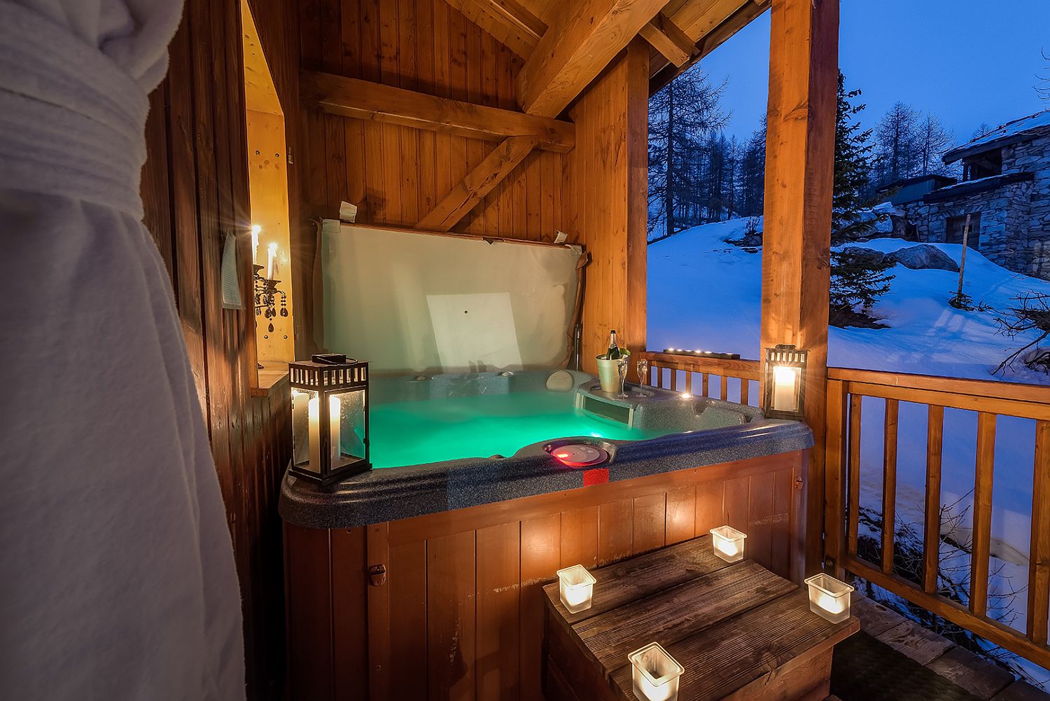 Hidden outdoor hot tub with a view of the ski slopes