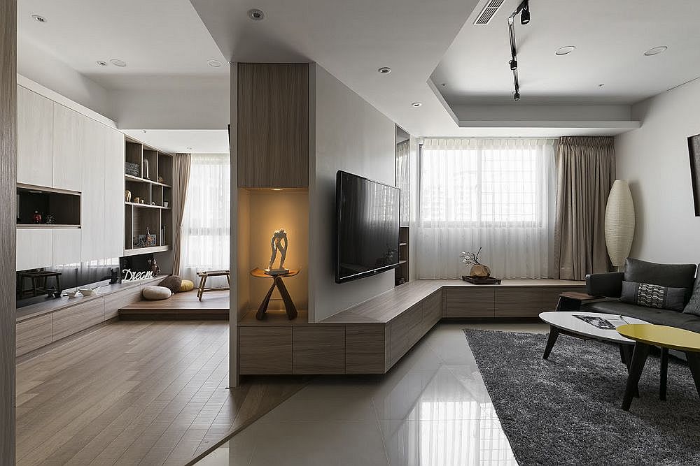 Living area and relaxing private zone inside small apartment with minimal decor