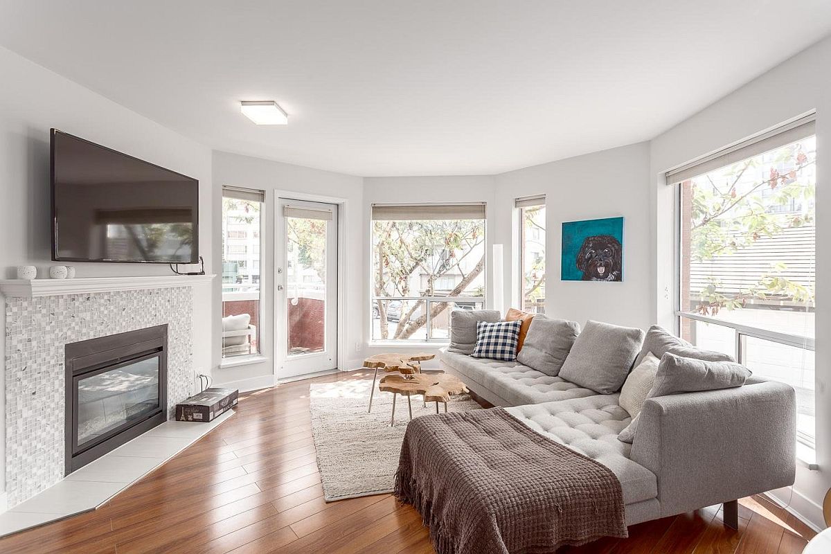 Living area with large gray section and live edge coffee tables