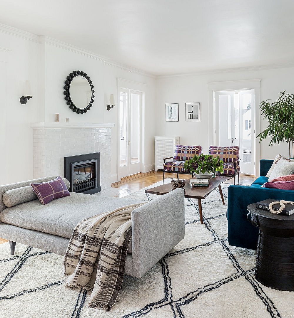 Living room in white with midcentury accents, comfy lounger and a chic rug