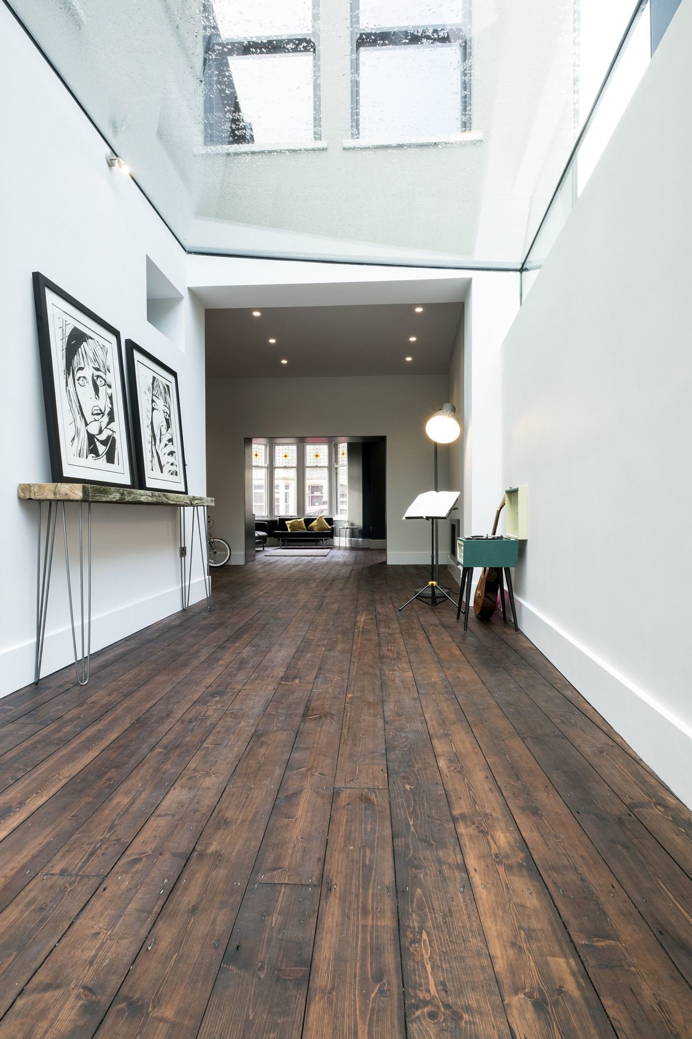 Long corridor connects the old house with the new kitchen and dining