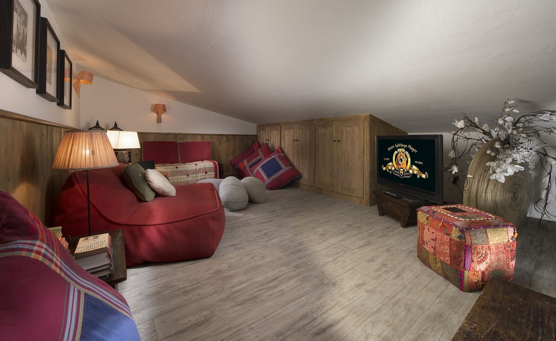 Luxurious-TV-room-with-sloped-ceiling-and-bean-bags