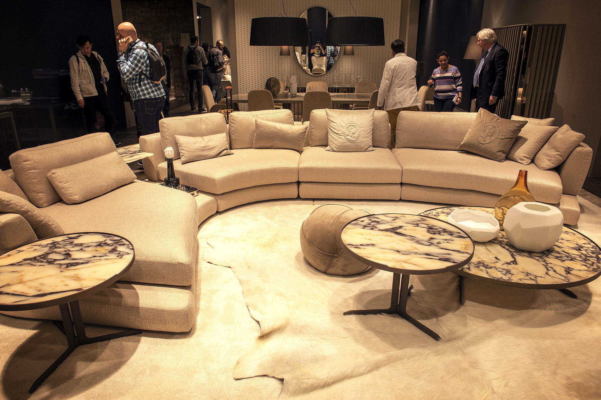 Marble-coffee-tables-coupled-with-semi-circular-sofa-with-modular-ease