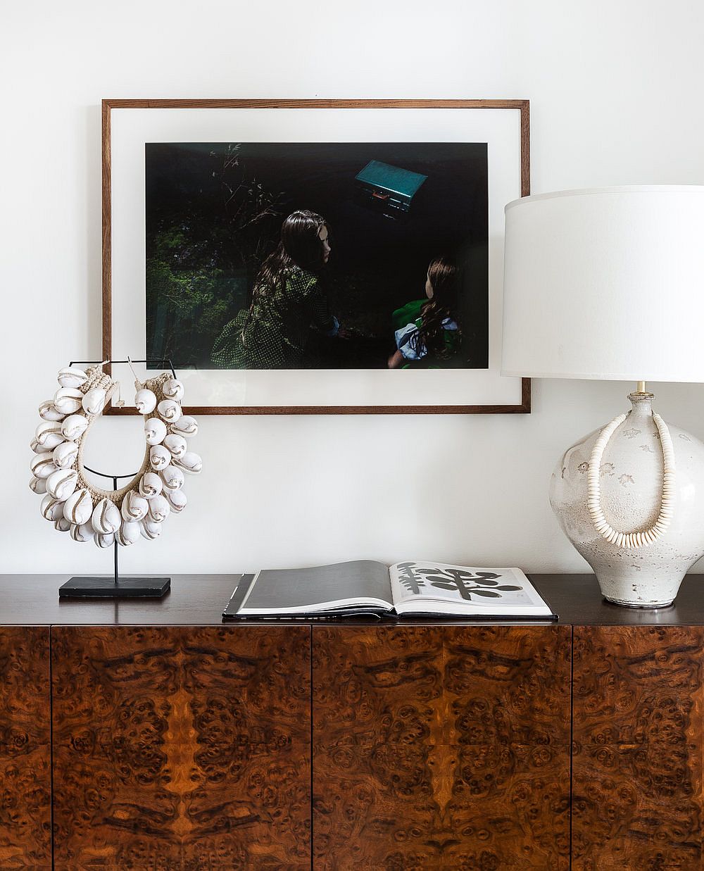 Midcentury-modern-side-table-with-table-lamp-and-decorative-piece