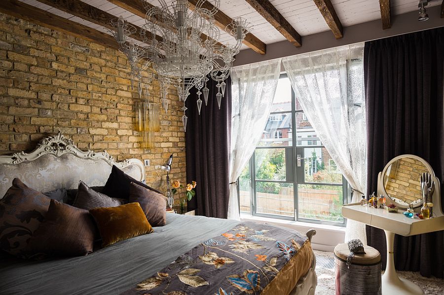 Neo Baroque bedroom with brick wall and chandelier