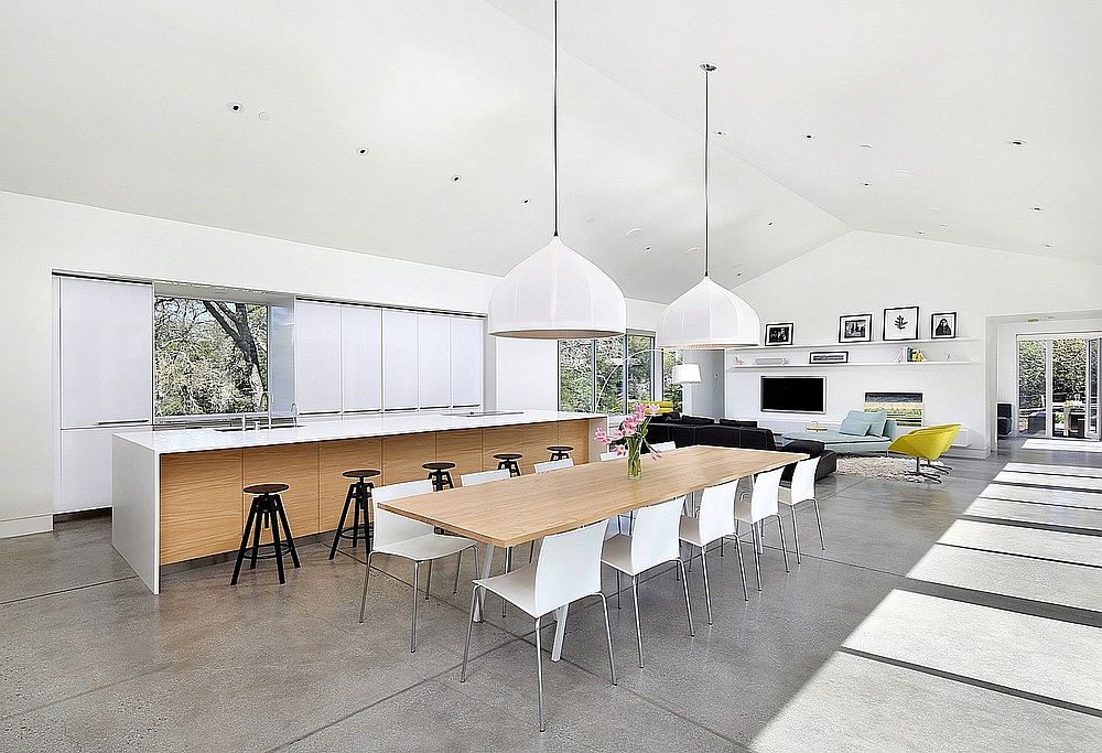 Open living area, kitchen and dining of Hillside Modern Residence