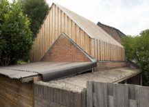 Original-birick-walls-of-the-old-shed-are-combined-with-new-wooden-facade-217x155