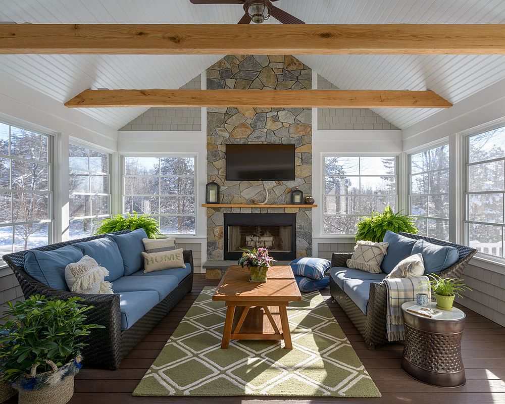 Placement of indoor plants brings a sense of symmetry to this cool, modern sunroom