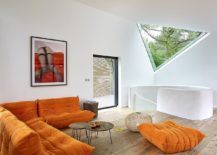 Plush-sofa-in-orange-for-contemporary-interior-in-white-217x155