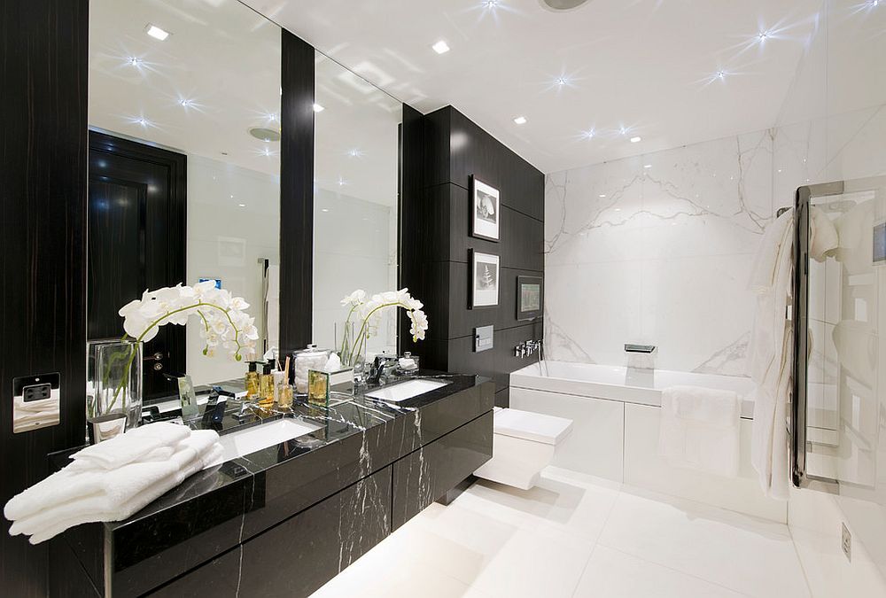 Polished-floating-vanity-in-black-brings-contemporary-dazzle-to-bathroom-in-white