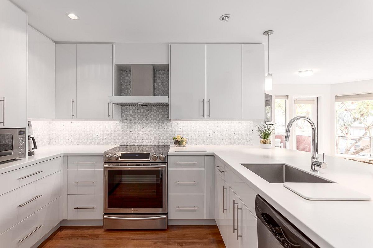 Polished modern kitchen with a glitzy backsplash