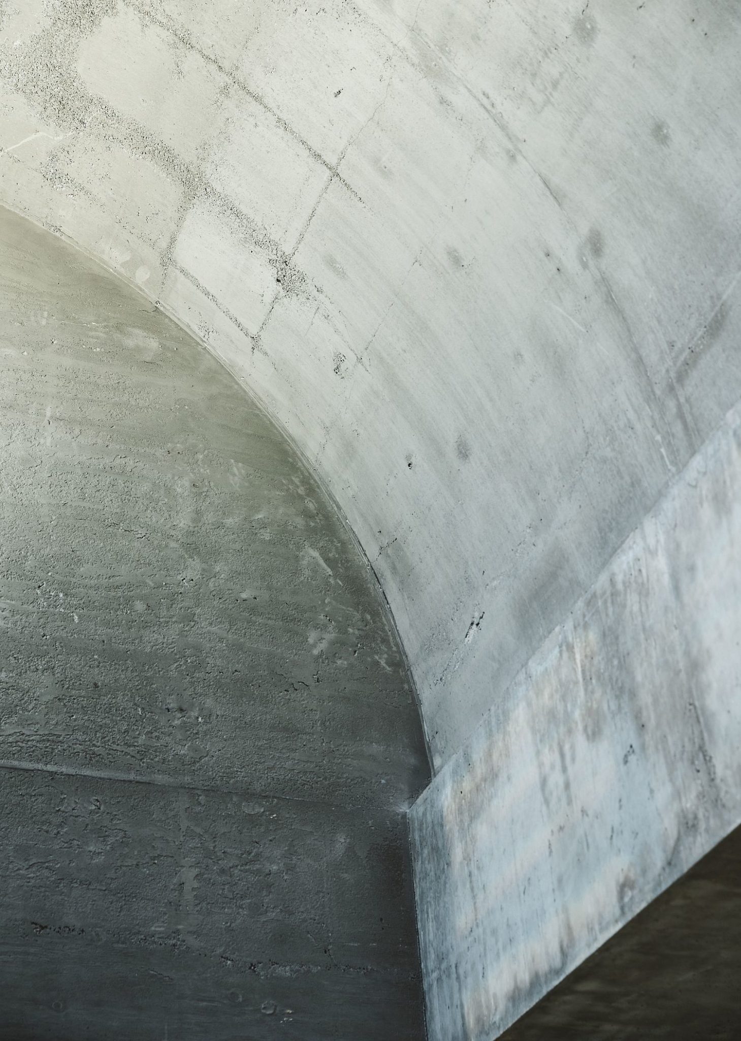 Raw concrete curved ceiling structures inside the Melbourne home