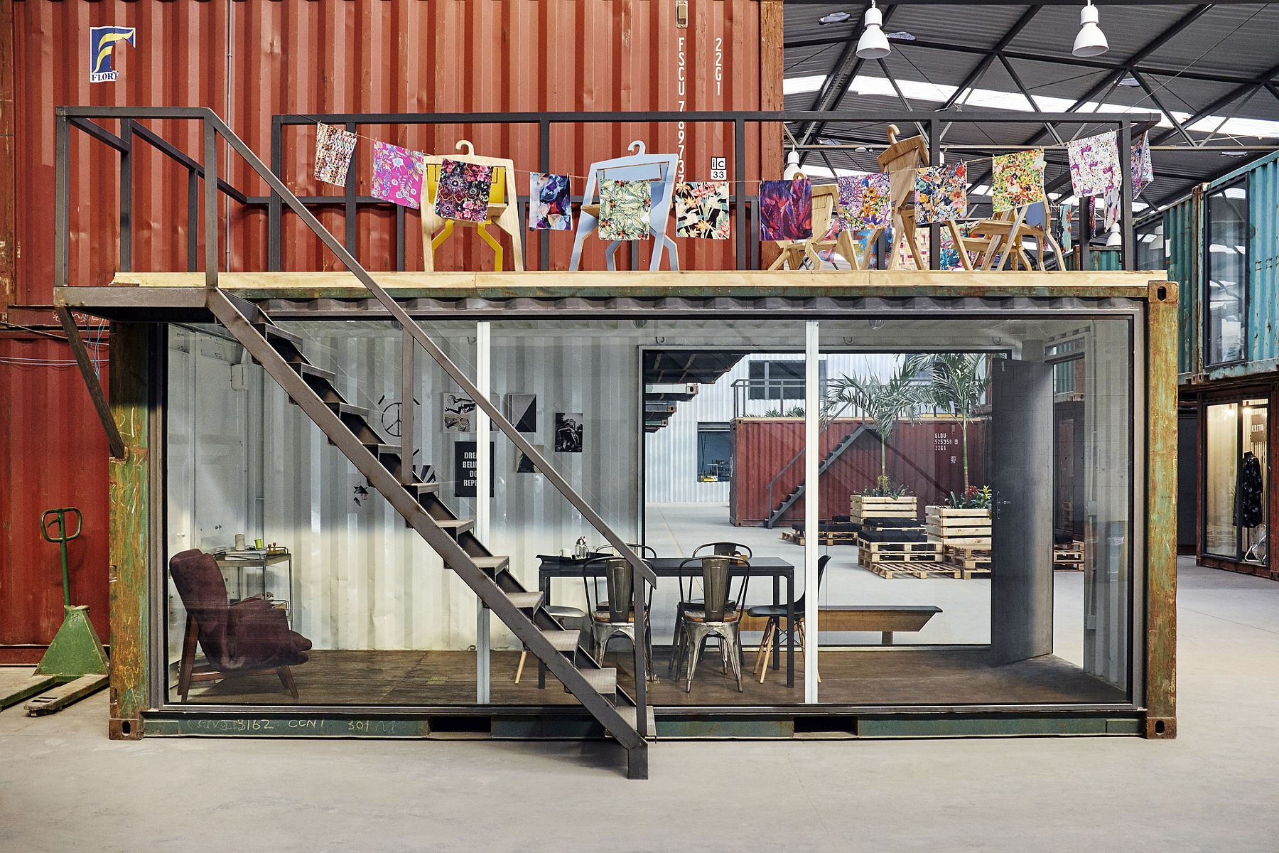 Repurposed shipping containers add to the sustainable style of the shed