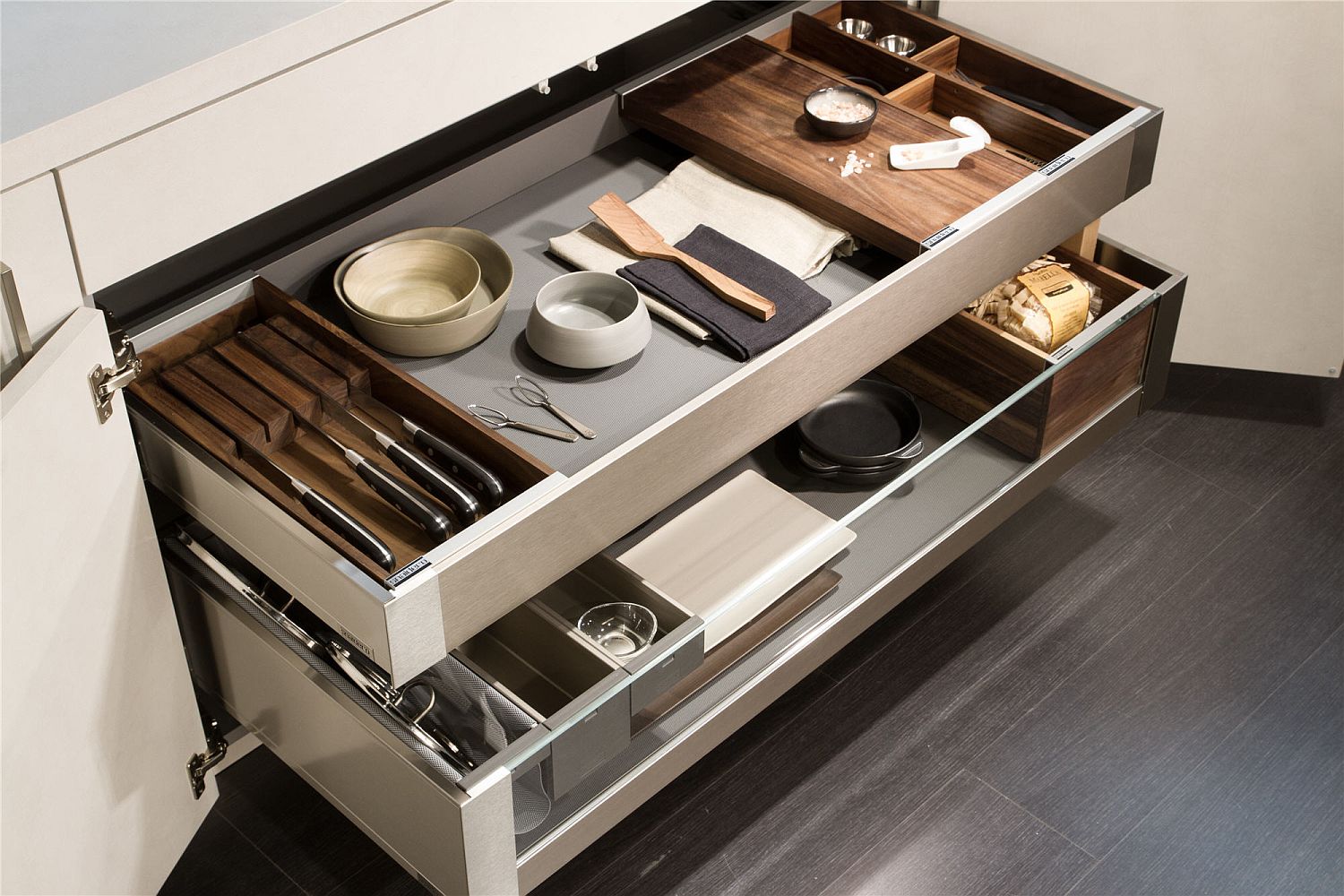 Sliding drawers in the kitchen island help tuck away cutlery