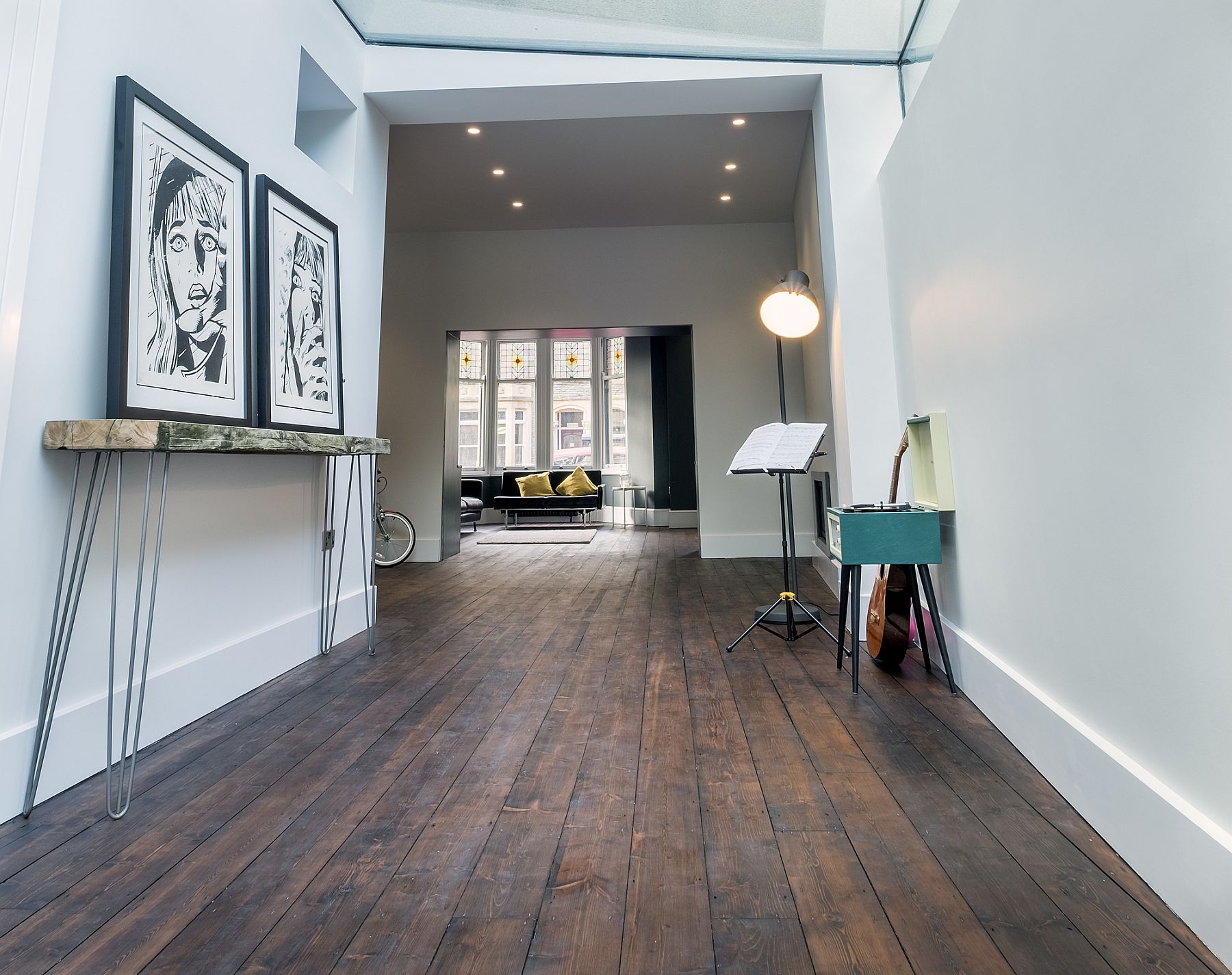 Slim-console-table-and-black-and-white-framed-art-work-for-the-contemporary-home