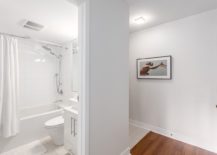 Small-bathroom-in-white-with-modern-fitting-at-the-Chilco-Street-condo-217x155