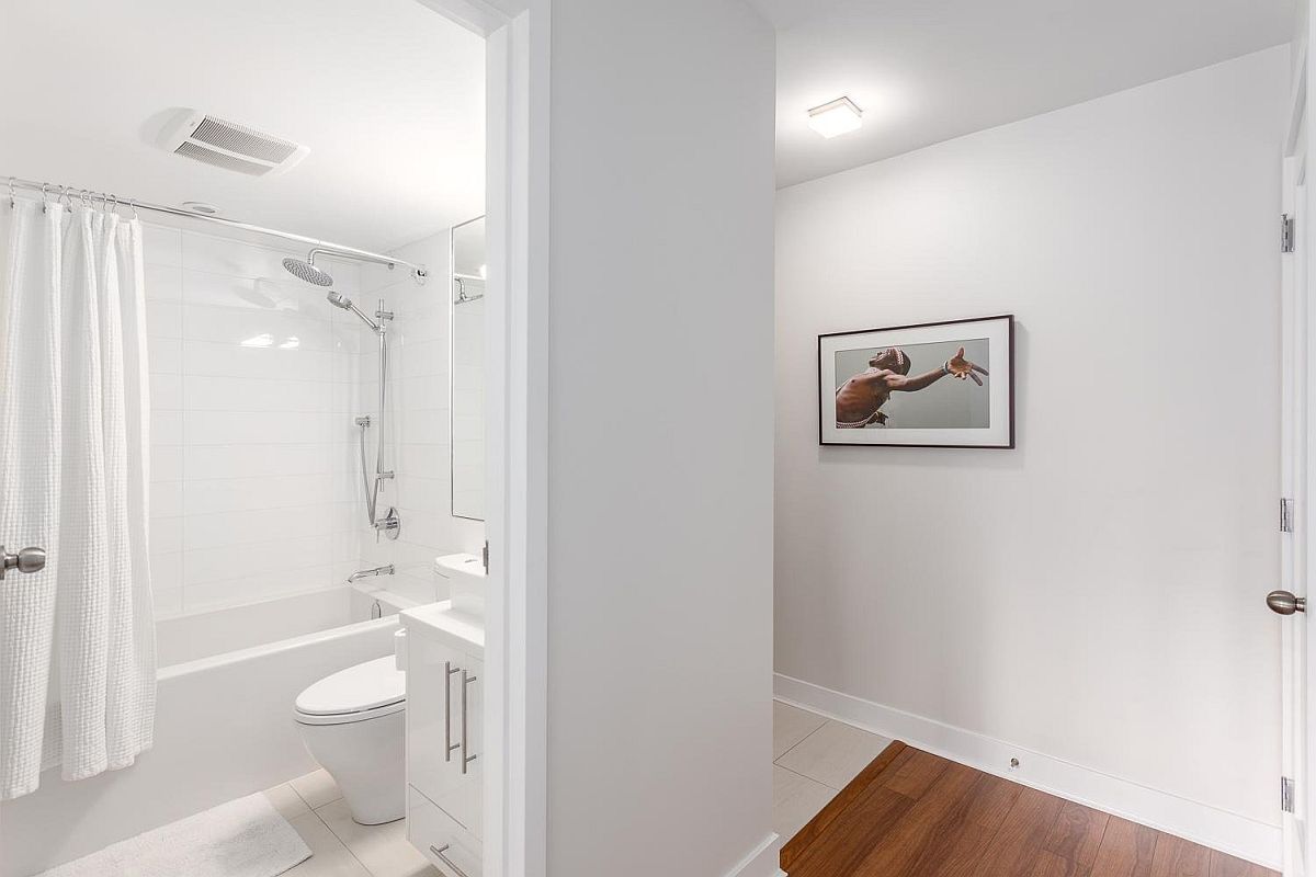 Small bathroom in white with modern fitting at the Chilco Street condo