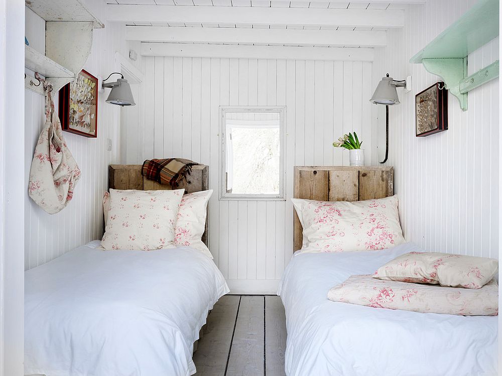 Small white shabby chic style guest bedroom with twin beds