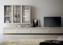 Smart and sleek TV unit and storage cabinet sits at the heart of the new living space 217x155 Living Carattere: Sophisticated and Minimal Spaces Designed for Urban Lifestyle