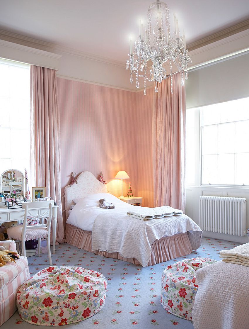 Smart shabby chic bedroom with a glittering chandelier at its heart!