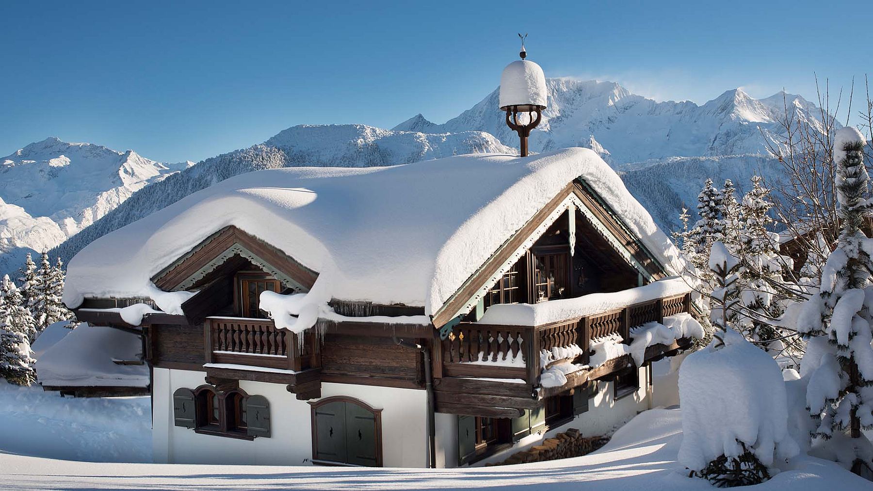 Snow covered exterior of the ultra-luxurious chalet in Courchevel