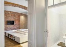 Stunning-bedroom-in-white-with-brick-walls-inside-the-apartment-of-a-football-player-217x155