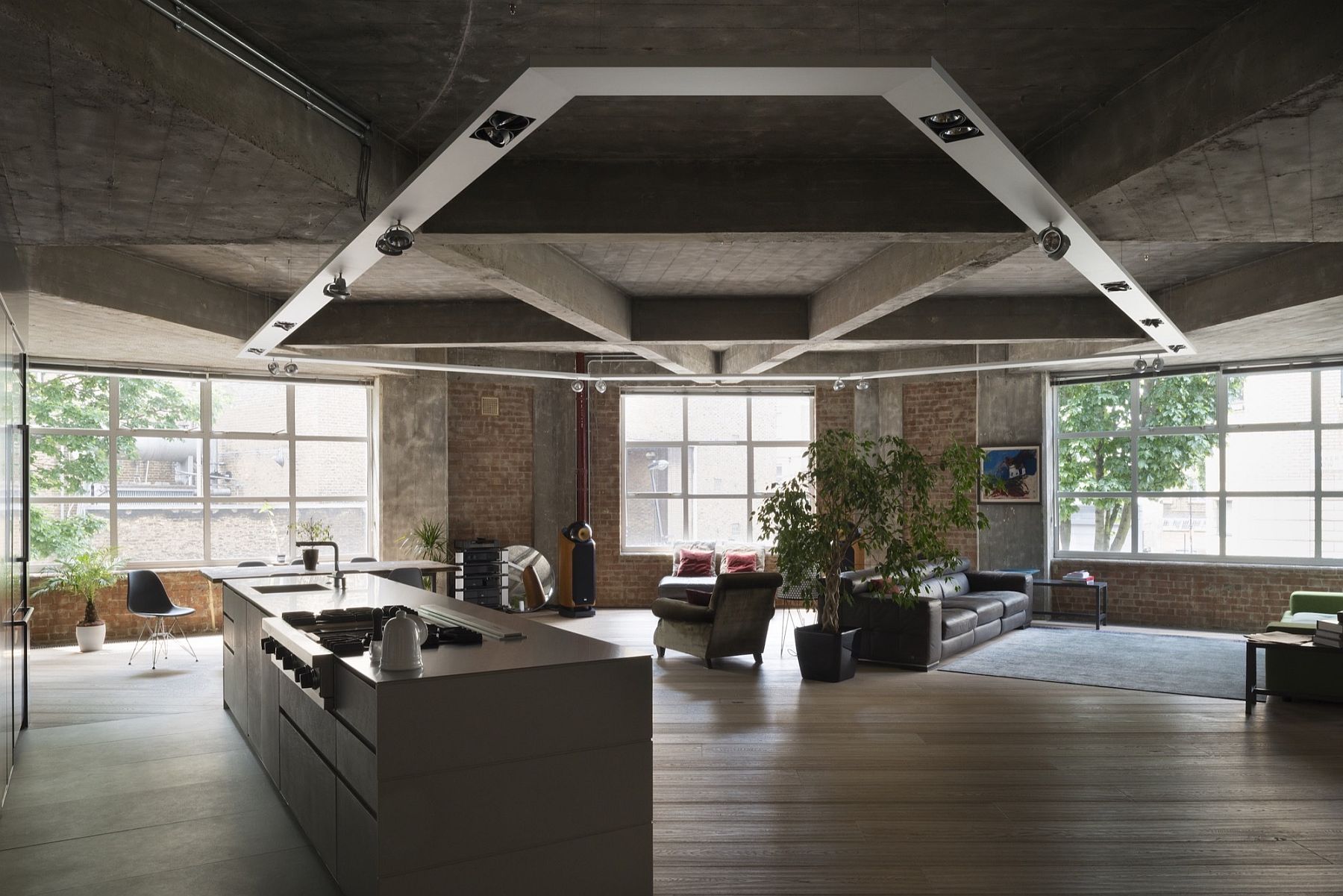 Stunning-concrete-ceiling-coupled-with-track-lighting-for-the-ope-living