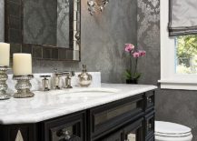 Stylish-powder-room-with-a-gorgeous-black-vanity-and-wallpaper-in-gray-and-silver-217x155