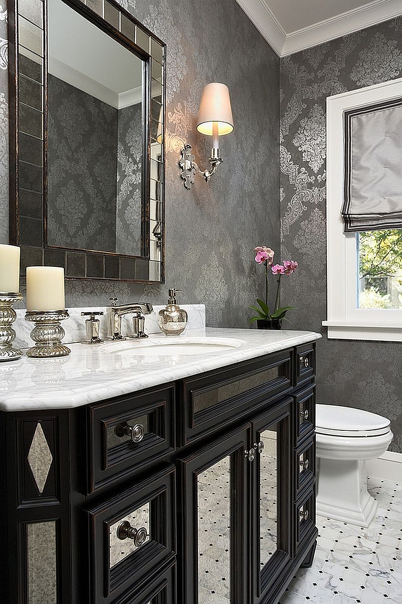 Stylish-powder-room-with-a-gorgeous-black-vanity-and-wallpaper-in-gray-and-silver