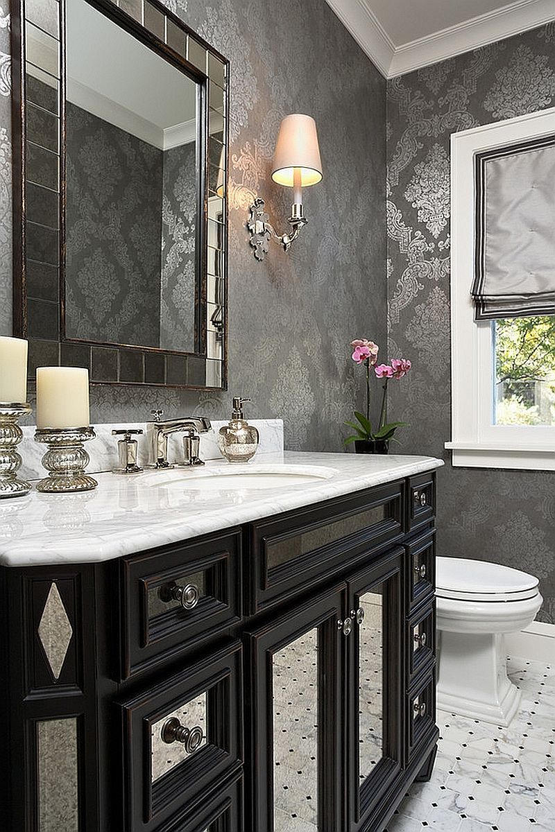 Stylish powder room with a gorgeous black vanity and wallpaper in gray and silver