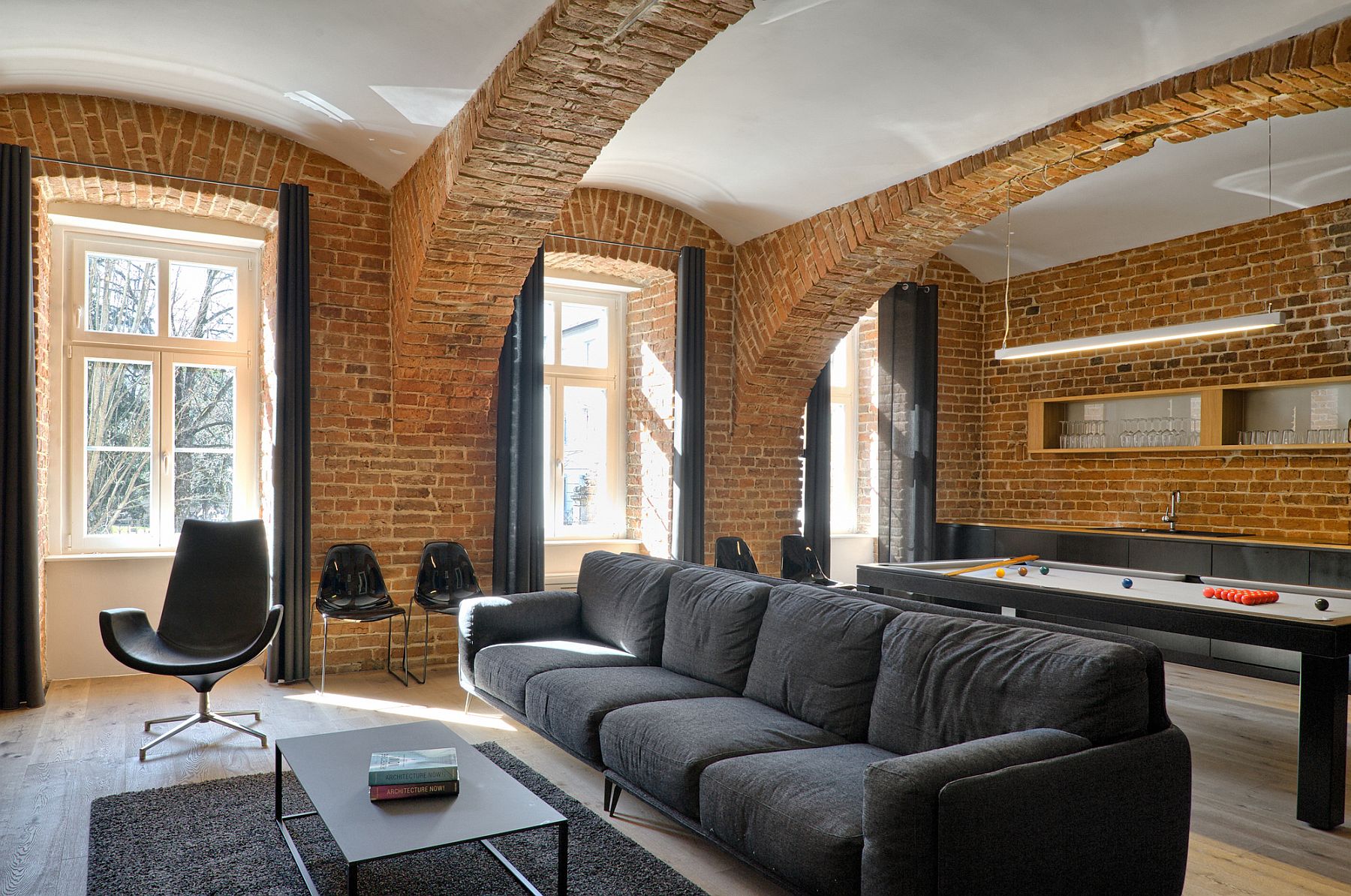 Traditional wooden framed windows bring natural light into the apartment