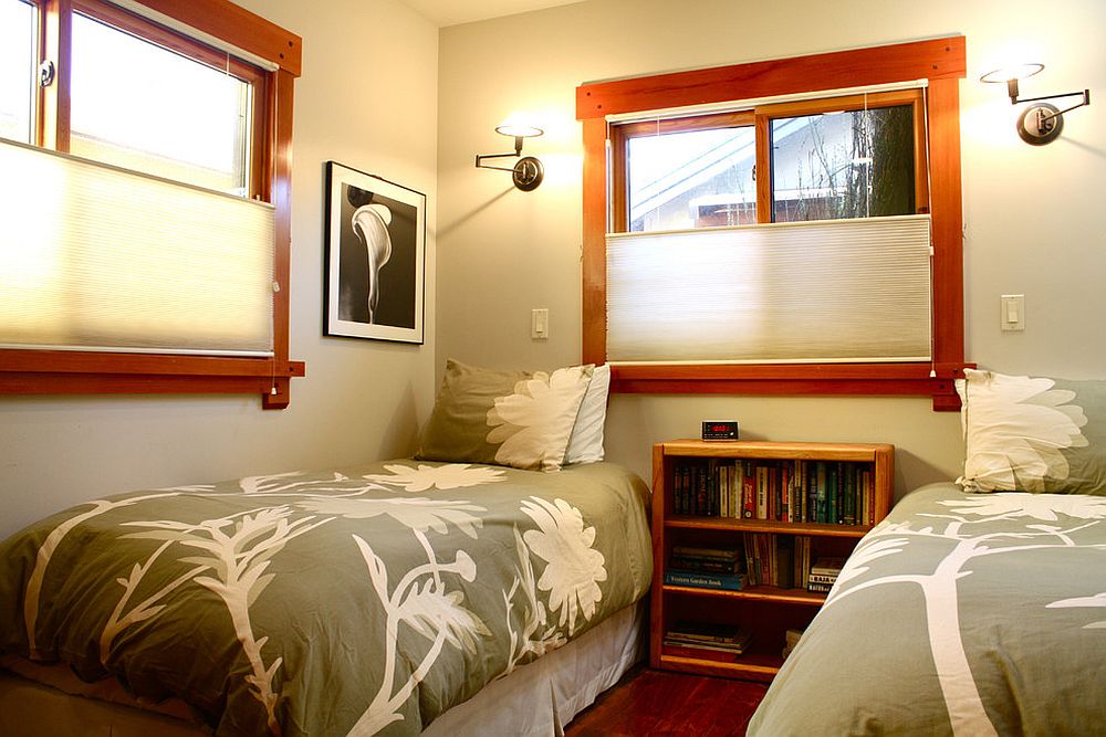 Twin bed guest room with ample space for books and accessories