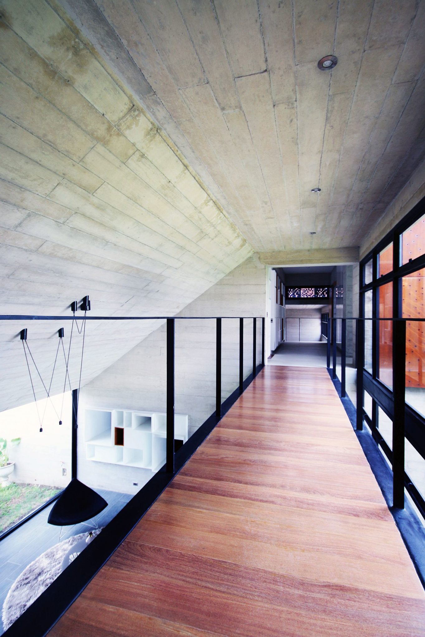 Walkway connecting the two upper levels of the home
