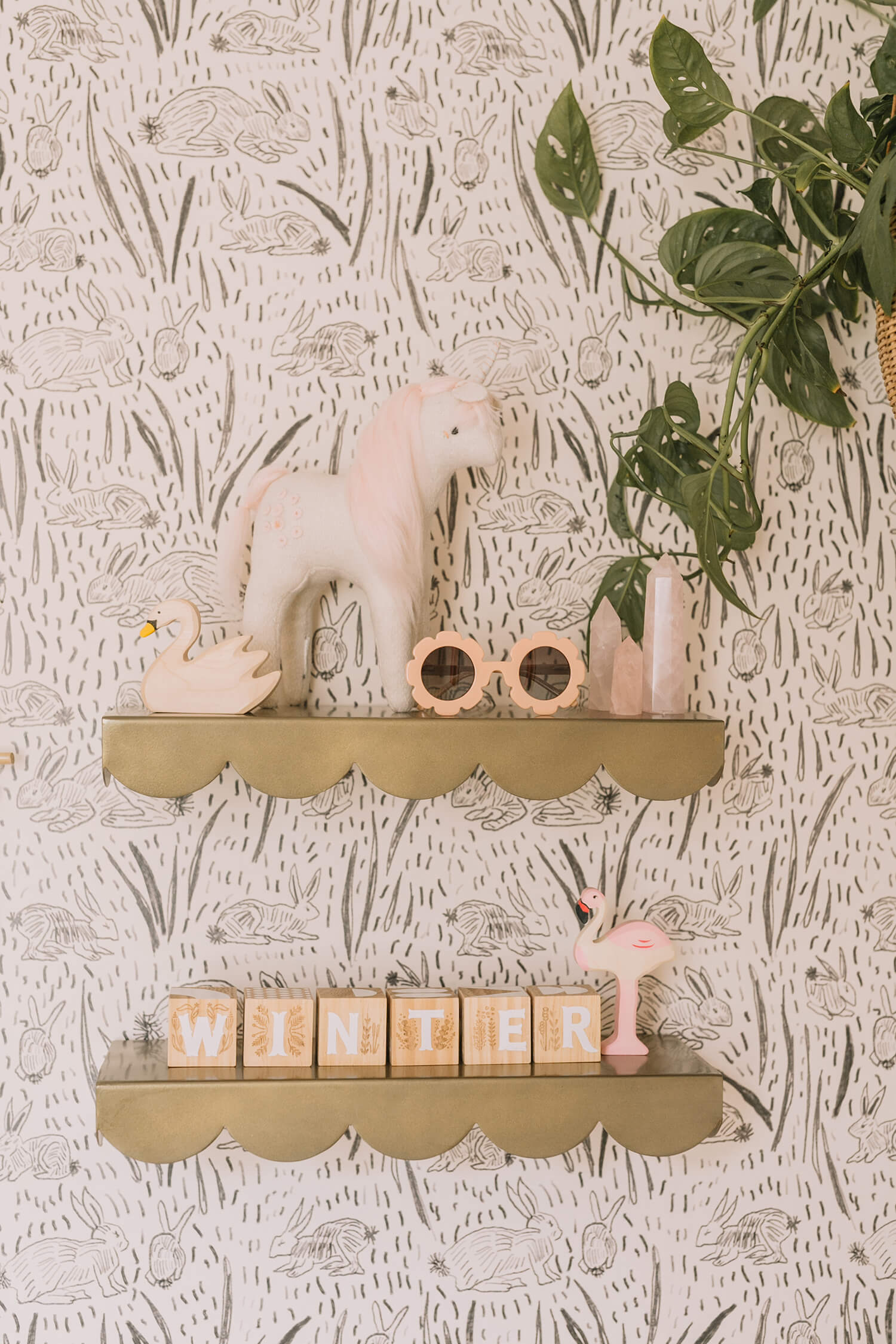 Whimsical wallpaper in a nursery by A Beautiful Mess
