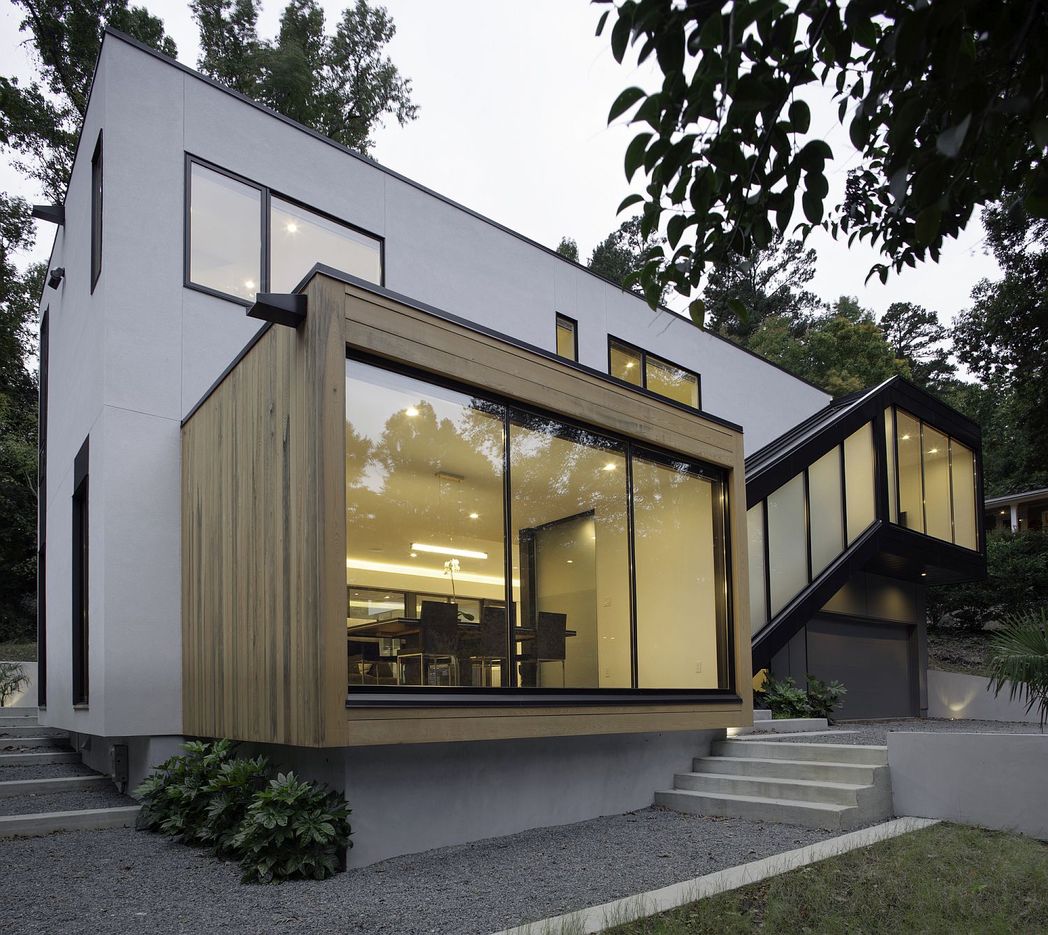 Wooden box style space that holds the dining area creates a room within a room