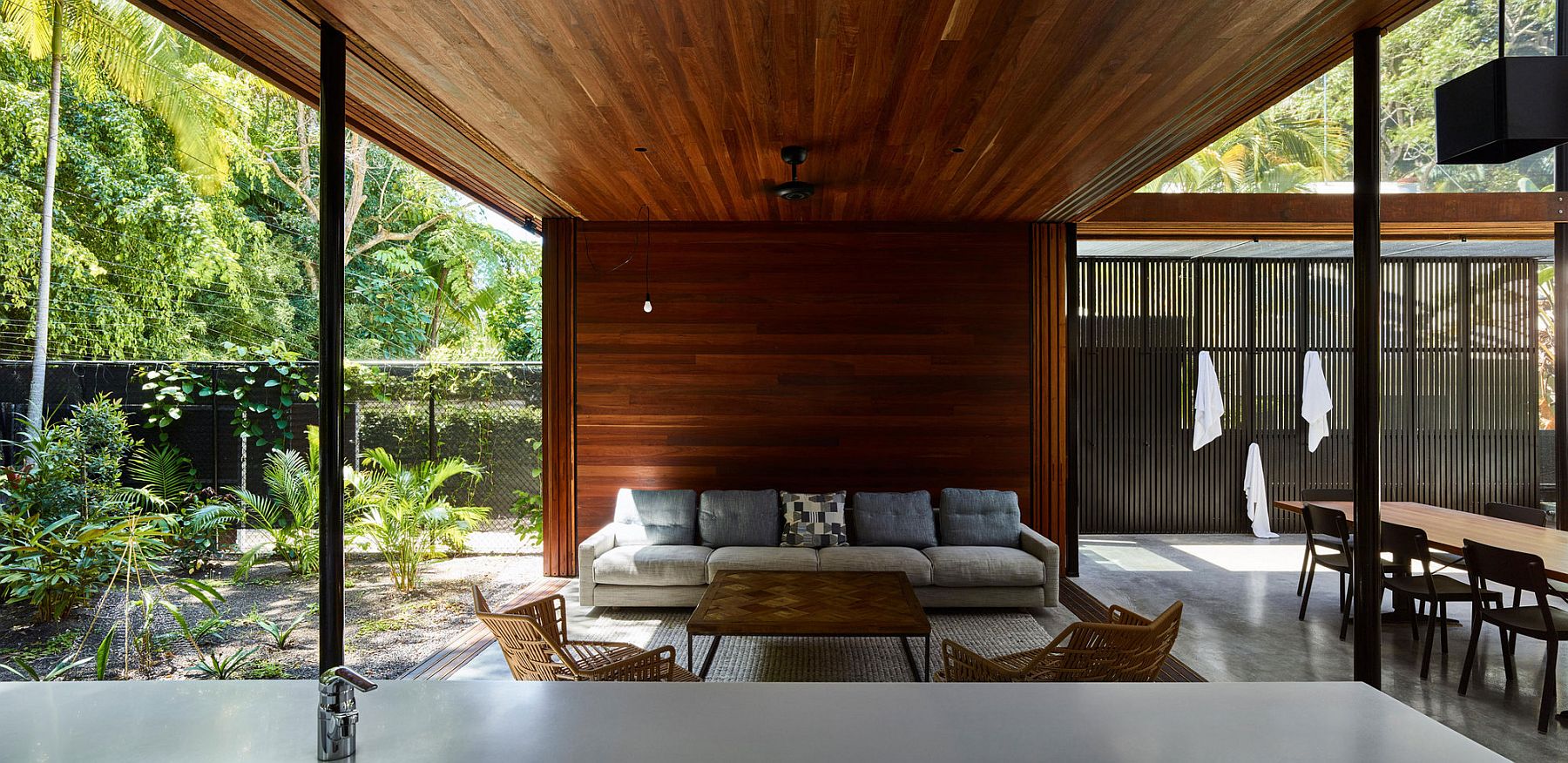 Wooden patio inside the verandah style home set in a Rainforest