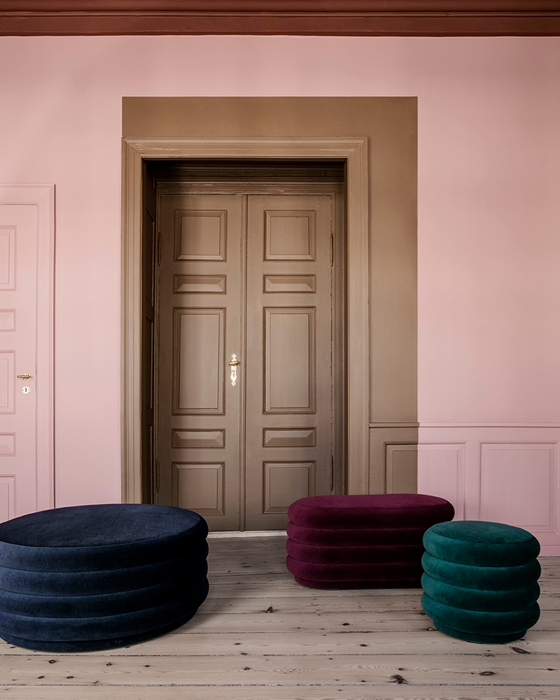 A blush background meets jewel-toned furniture