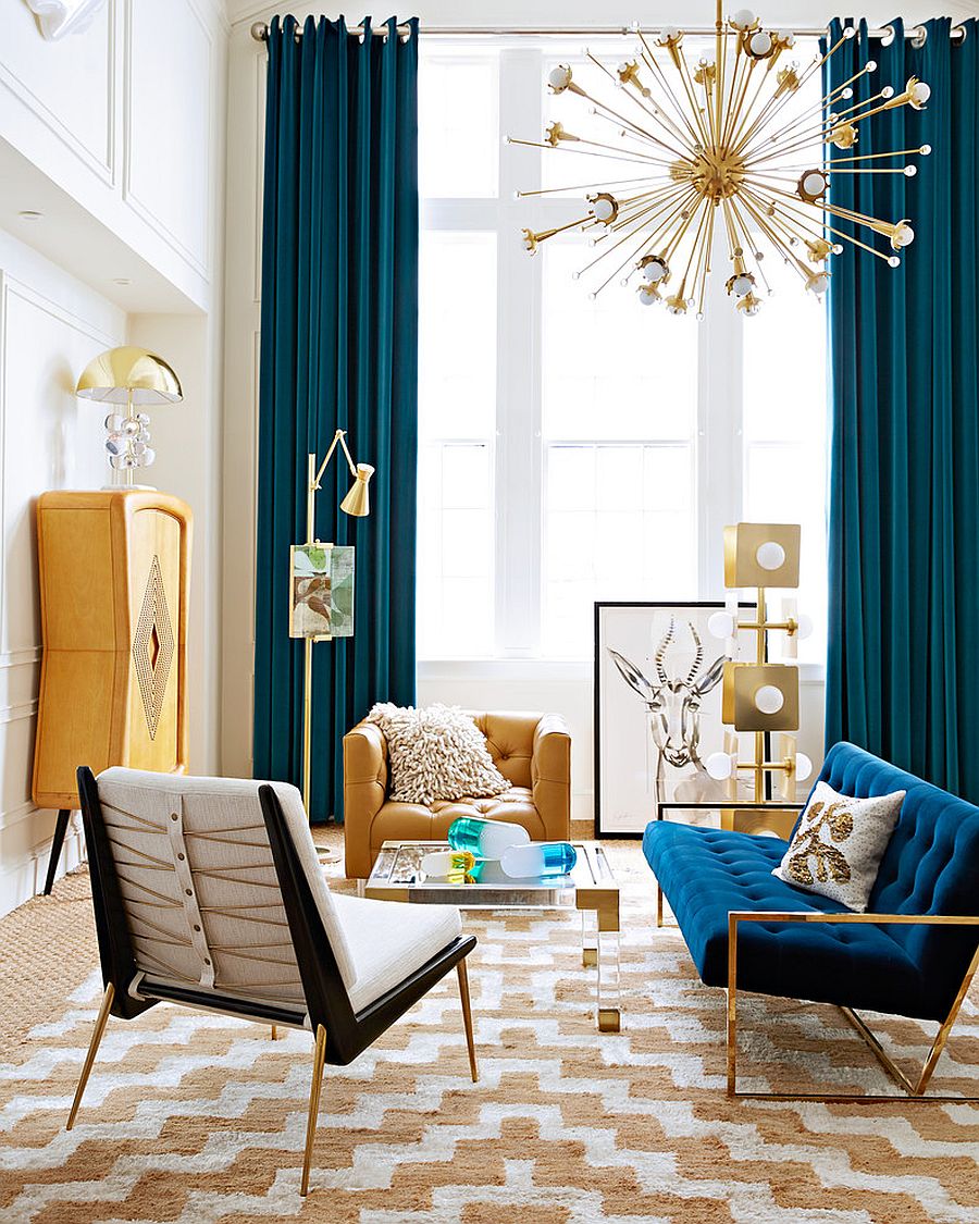 Blue drapes offer a dramatic backdrop to the living space