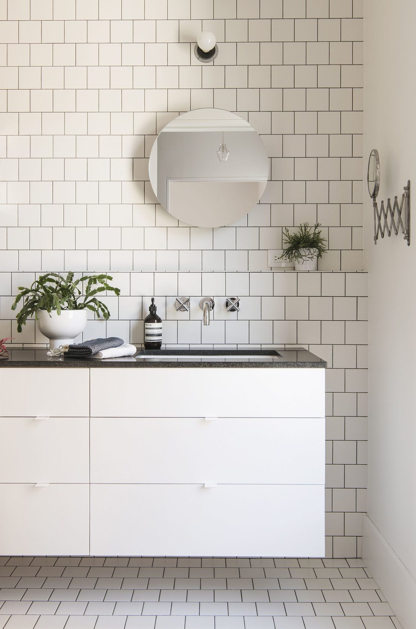 Classic tiled bathroom design translated to modern Brooklyn townhouse
