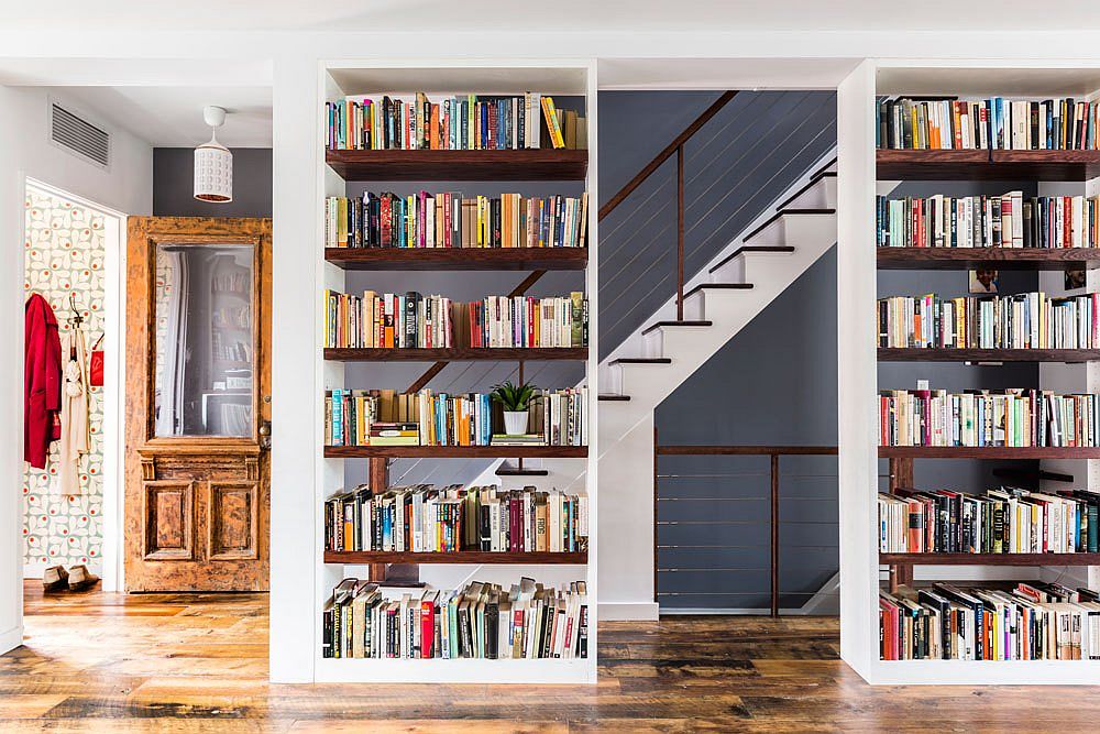 Cleverly placed twin bookshelves in the large living room make a big impact