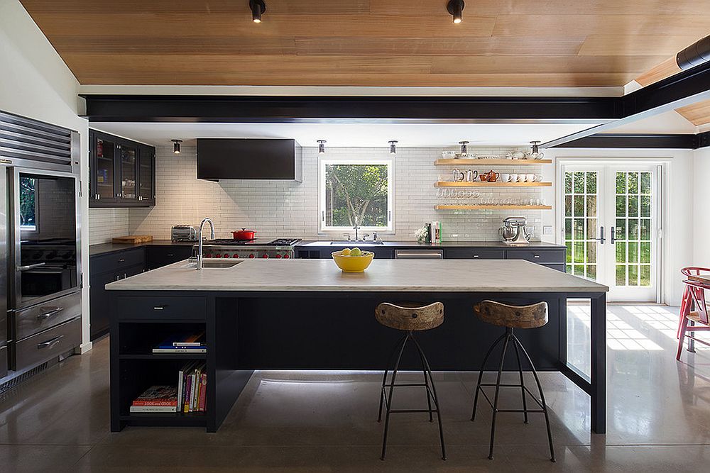 Contemporary kitchen with tiled backsplash and concrete floor