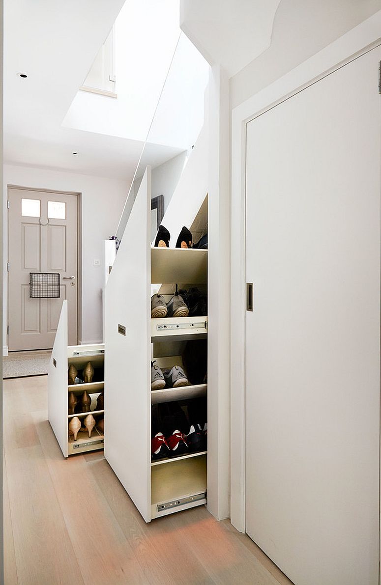 Contemporary staircase with storage space for shoes underneath