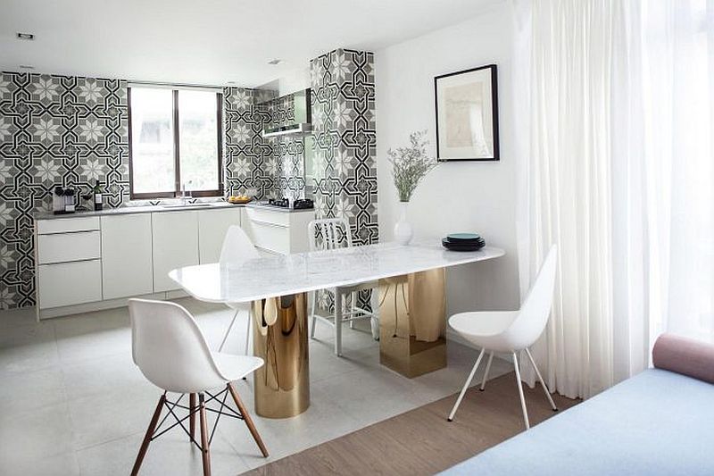 Contemporary white kitchen with black and white tiled backdrop