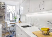 Corner-breakfast-area-and-workspace-for-the-polished-kitchen-in-white-217x155